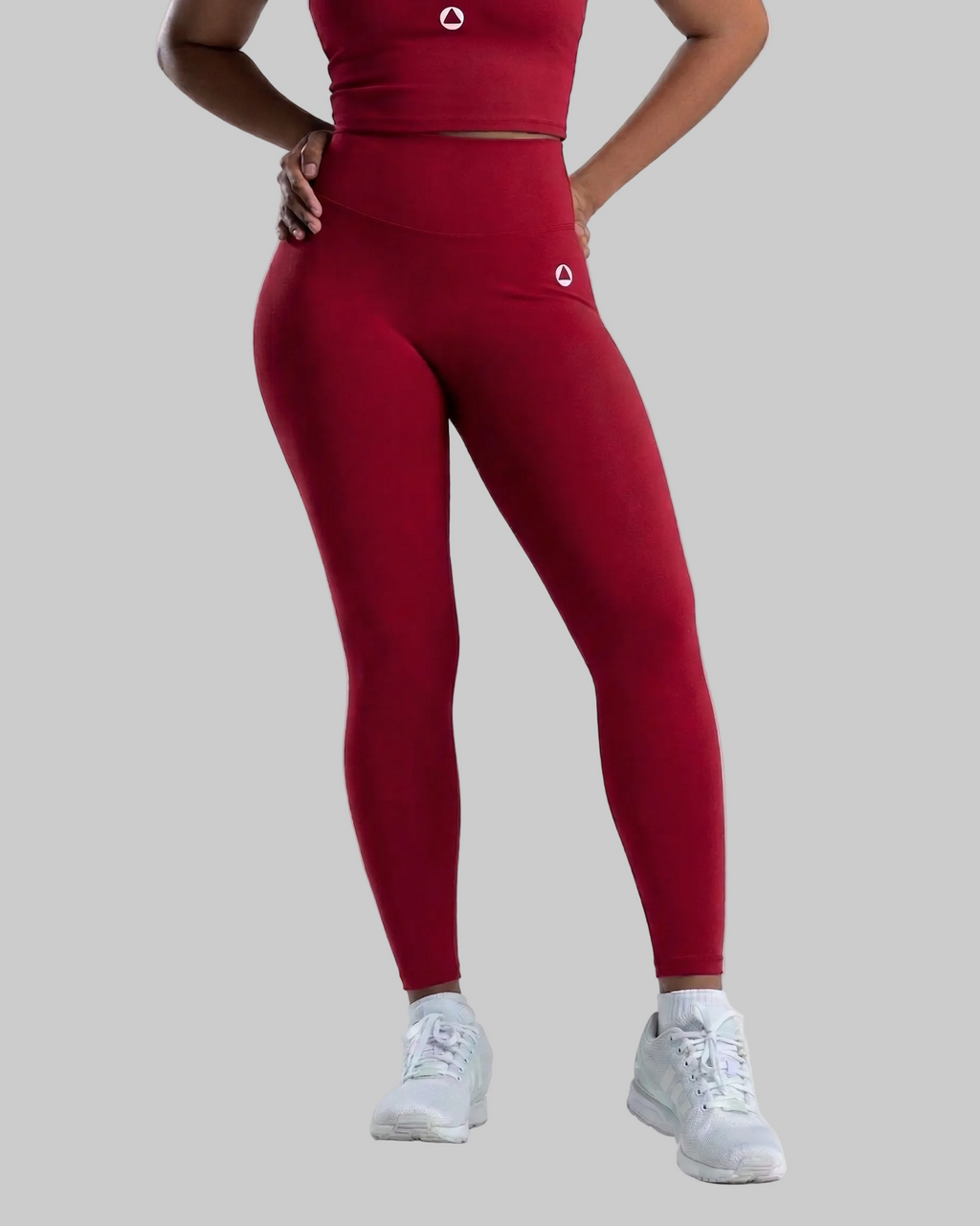 Person wearing Crimson Pulse Velocity leggings and a matching Crimnson Pulse Volcity Sports Bra on a white background