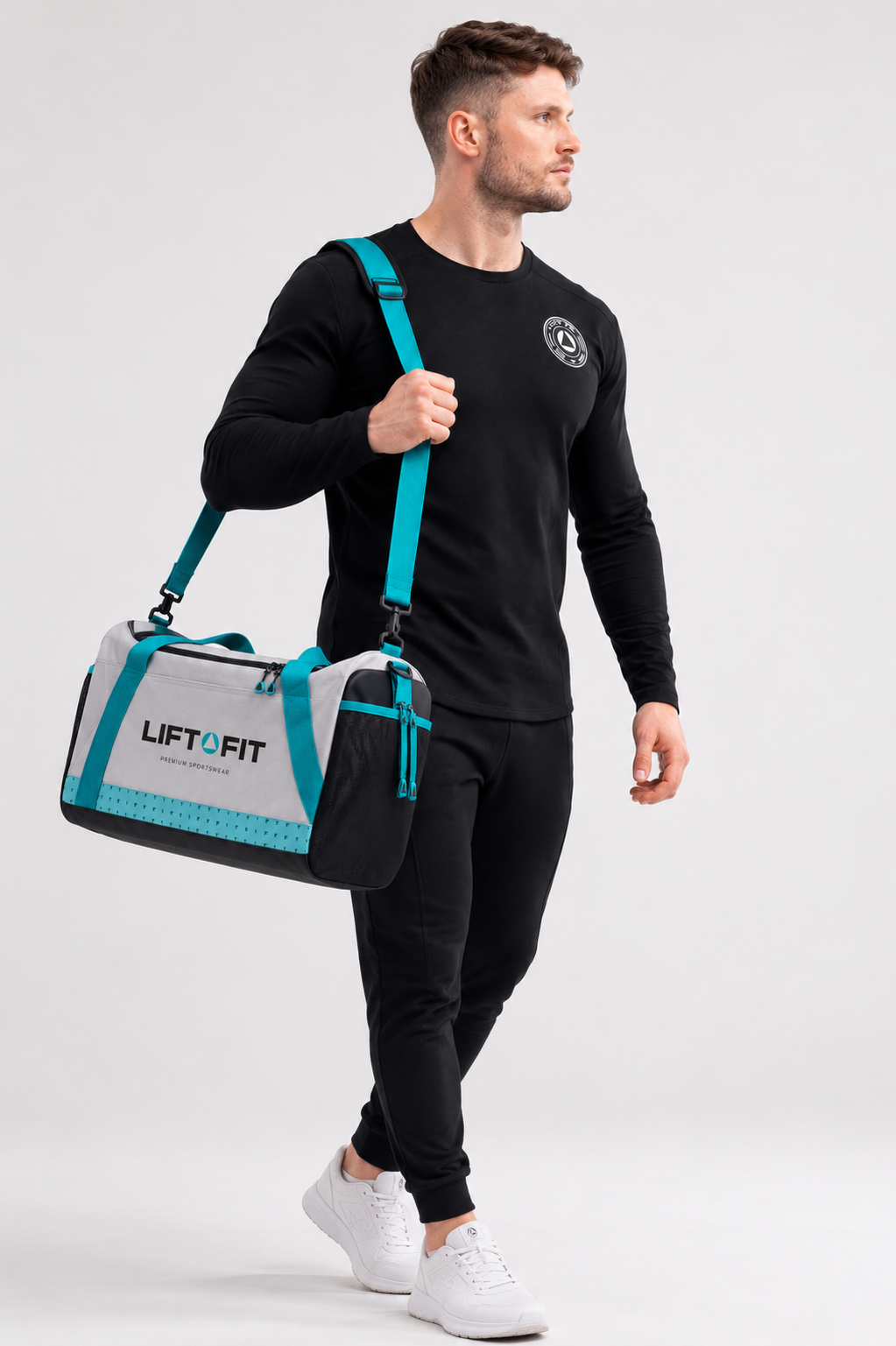 Man carrying LF Tog Bag gym duffel in grey and turquoise over shoulder — LIFT FIT